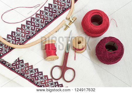 Fragment of embroidery on linen and accessories