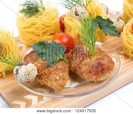 Chopped chicken cutlets. Served with dill and parsley.