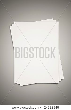 white paper stacked on grey texture background