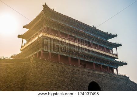 Beijing, China at the Zhengyangmen Gatehouse in Tiananmen Square. Beautiful historical building at sunset.