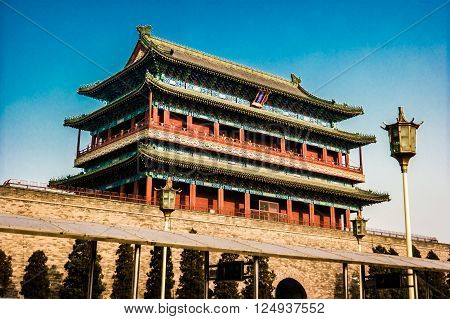 Beijing, China at the Zhengyangmen Gatehouse in Tiananmen Square. Beautiful historical building at sunset.