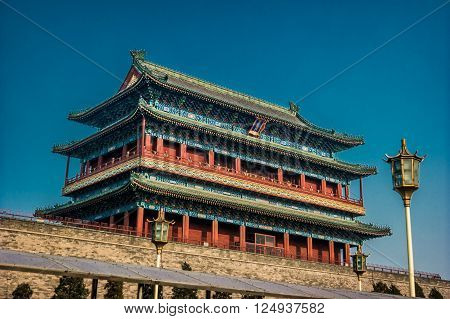 Beijing, China at the Zhengyangmen Gatehouse in Tiananmen Square. Beautiful historical building at sunset.