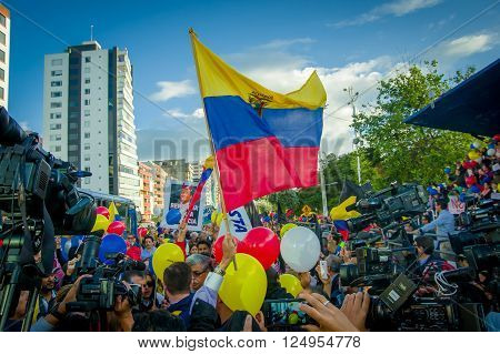 Quito, Ecuador - April 7, 2016: Closeup opposition leader Andres Paez surrounded by people, police and journalists during anti government protests in Shyris Avenue.