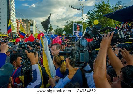 Quito, Ecuador - April 7, 2016: Closeup opposition leader Andres Paez surrounded by people, police and journalists during anti government protests in Shyris Avenue.