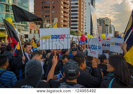 Quito, Ecuador - April 7, 2016: Group of people Holding protest signs, police and journalists during anti government protests in Shyris Avenue.