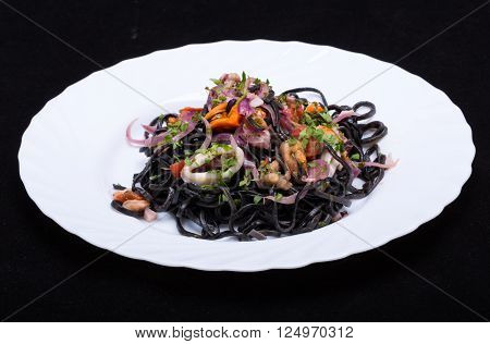 Black Spaghetti With Seafood And Vegetables On Plate