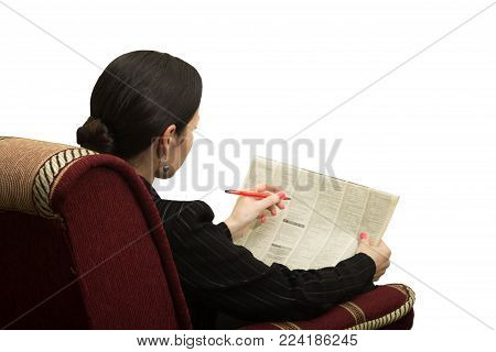 Young Woman In A Chair Reading A Newspaper With An Advertisement - In Search Of Work