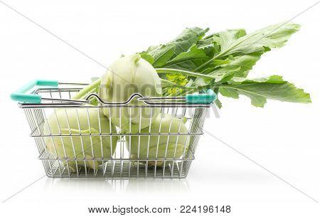 Kohlrabi (German turnip or turnip cabbage) with leaves in a shopping basket isolated on white background three bulbs fresh raw