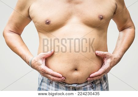 Fat Man Checking His Weight On Gray Background