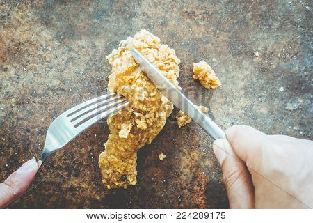 Fried tasty chicken on stone retro background