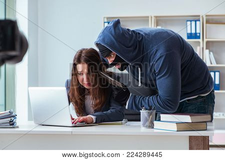 Criminal taking businesswoman as hostage in office