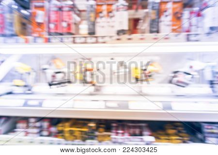 Blurred Row Of Power Tool Combo Kits At Hardware Store In America