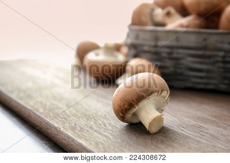 Cremini mushroom on wooden table