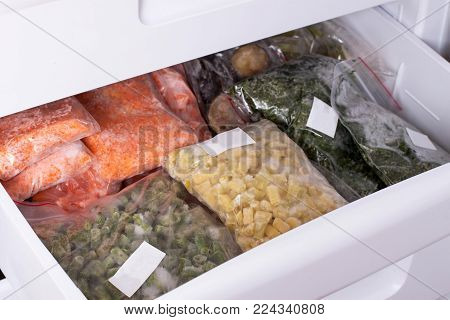 Assortment of frozenVegetables in home fridge. Frozen food in the freezer