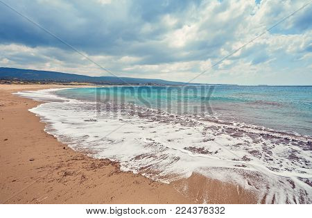 Beautiful wild beach with clear turquoise water and waves. Lara beach, Cyprus.
