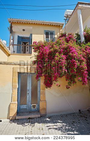 Typical exterior of Greek traditional town street with colorful buildings and marine blue door on Kastelorizo Island, Dodecanese, Greece, Europe