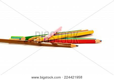 colored pencils are in a different order on a white background