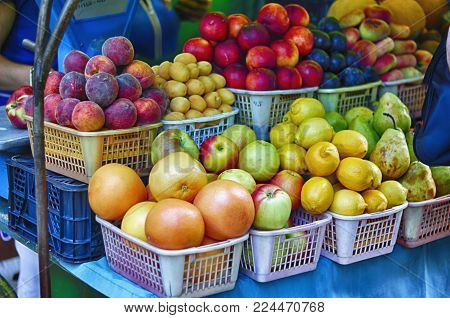 Different colorful fruits on the counter in the market