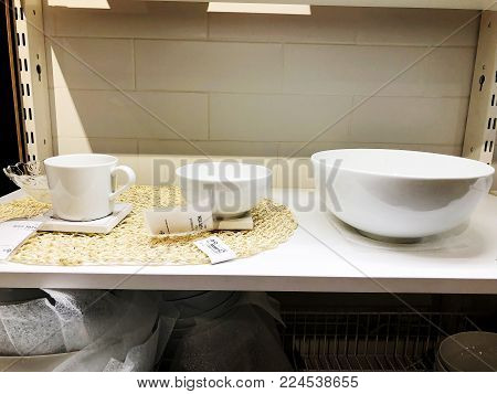 RISHON LE ZION, ISRAEL- DECEMBER 16, 2017: A stack of white plates.Plenty of plates. Plates from the restaurant. White plates. Plates for food