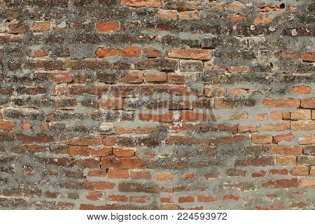 City brick wall ruined by time lapse