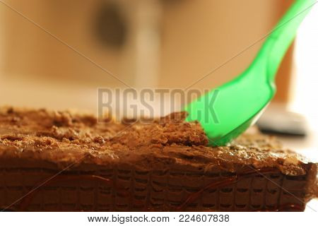 Plastic spoon in chocolate cake birthday celebration spirit