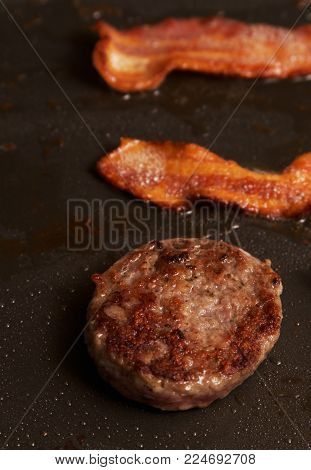 Close up of cooking pork meat on a grill.
