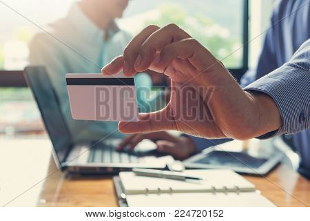 Businessman Holding Credit Card And Using Laptop To Shopping Online