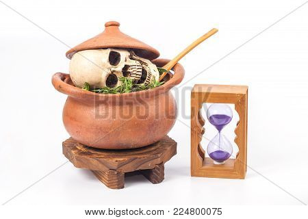 Boiled Skull In Clay Pot With Some Herb On White Background