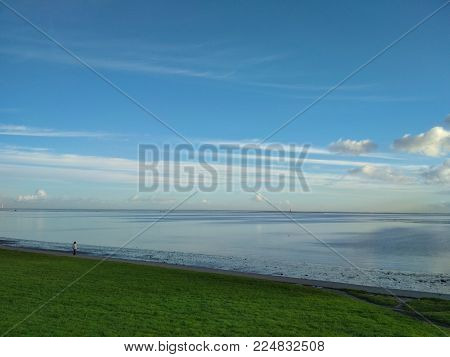 Reflections in the water of Wilhelmshaven Beach, Suedstrand