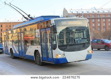 ST. PETERSBURG, RUSSIA - JANUARY 23, 2018: Trolleybus Public Transport Vehicle on Saint-Petersburg City Street Close Up. Trolleybus is an Electric Bus with Overhead Wires.