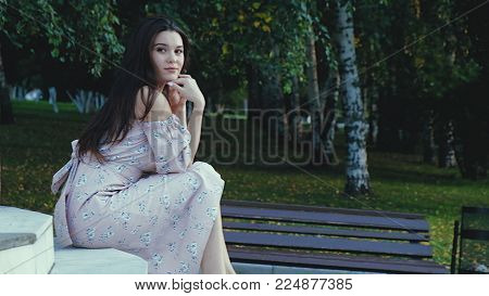 Happy beautiful woman walking in the city, steadicam shot 4k