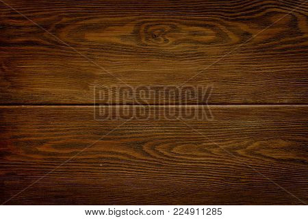 Dark brown wooden background. Old brown board texture