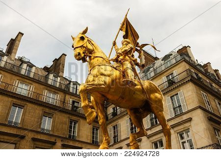The golden statue of Saint Joan of Arc on the Rue de Rivoli in Paris, France