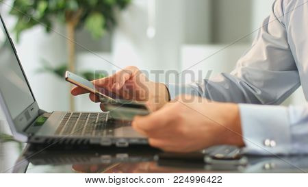 Business man inserting credit card number in mobile phone app, online banking HD