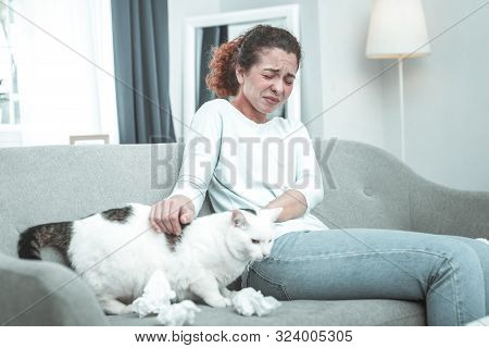 Woman Feeling Bad Sitting Near Cat While Having Allergy