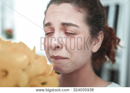 Curly Housewife Having Tears Because Of Allergy To Flowers