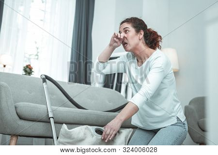Housewife Having Allergy To Dust After Using Vacuum Cleaner