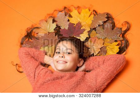 Little Girl Small Child Gorgeous Long Hair And Fallen Maple Leaves. Moisturizing Mask. Deep Conditio