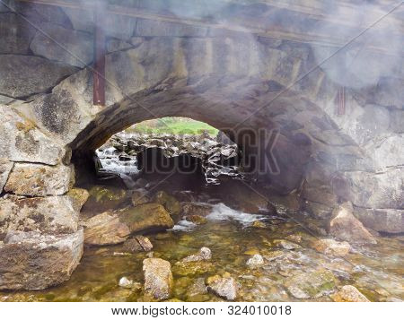 Detail View. Stone Bridge Arch And Water. Road Crossing River, Latefoss Norway.
