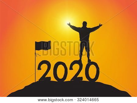 Silhouette Of Young Man Standing On Top Of The Mountain On Year 2020 With Hands Up With Flag On Sunr