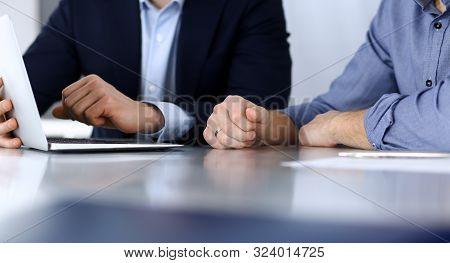 Business People Using Tablet Computer While Working Together At The Desk In Modern Office. Headshot 