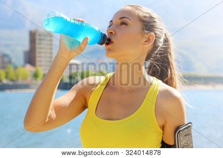 Thirsty Athlete Drinking Power Drink After Long Run Train.