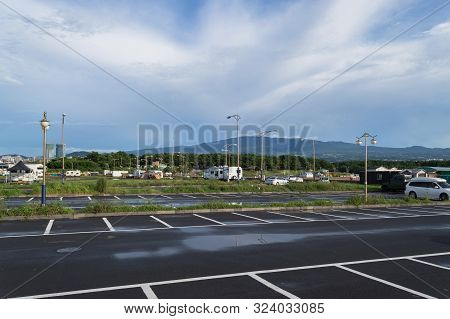 Parking Lot Near Iho Tewoo Beach After Rain On Jeju Island With Beautiful Cloudscape On Background