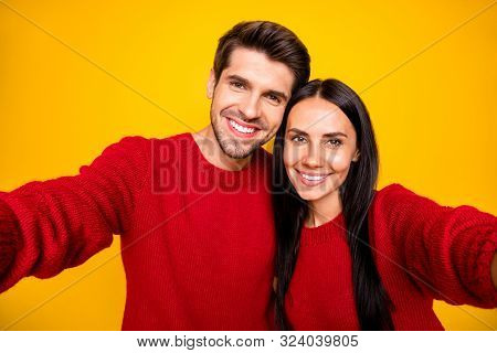 Close Up Photo Of Cheeerful Spouses Make Self-portrait Wear Red Sweater Isolated Over Yellow Backgro