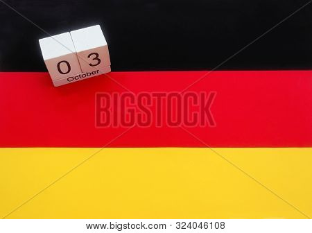 Date Of The Holiday German Unity On A German Flag, Conceptual Background
