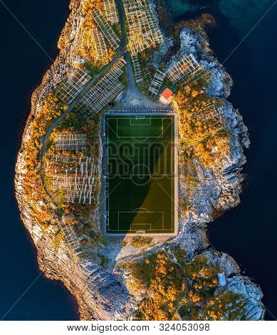 Football Field In Henningsvaer From Above. Henningsvaer Is A Fishing Village Located On Several Smal