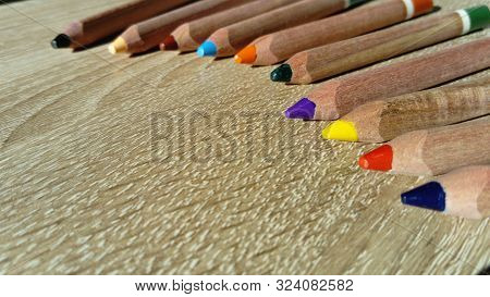 Multi-colored Wooden Pencils Of A Triangular Shape In A Section Are Intended For The Development Of 