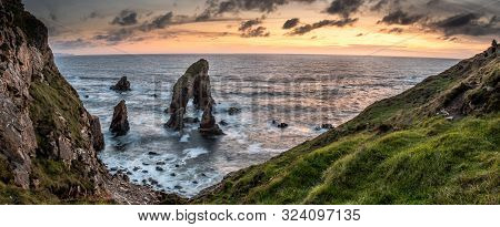 Long Tme Exposure Of Crohy Head Sea Arch Breeches During Sunset - County Donegal, Ireland
