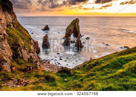 Long Tme Exposure Of Crohy Head Sea Arch Breeches During Sunset - County Donegal, Ireland