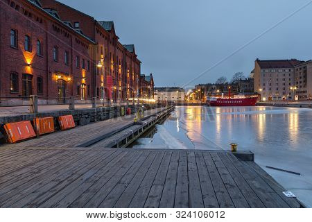 Helsinki, Finland- 28 February 2015: Wooden Catwalk Along Kanavaranta Street In Helsinki Marina. Red